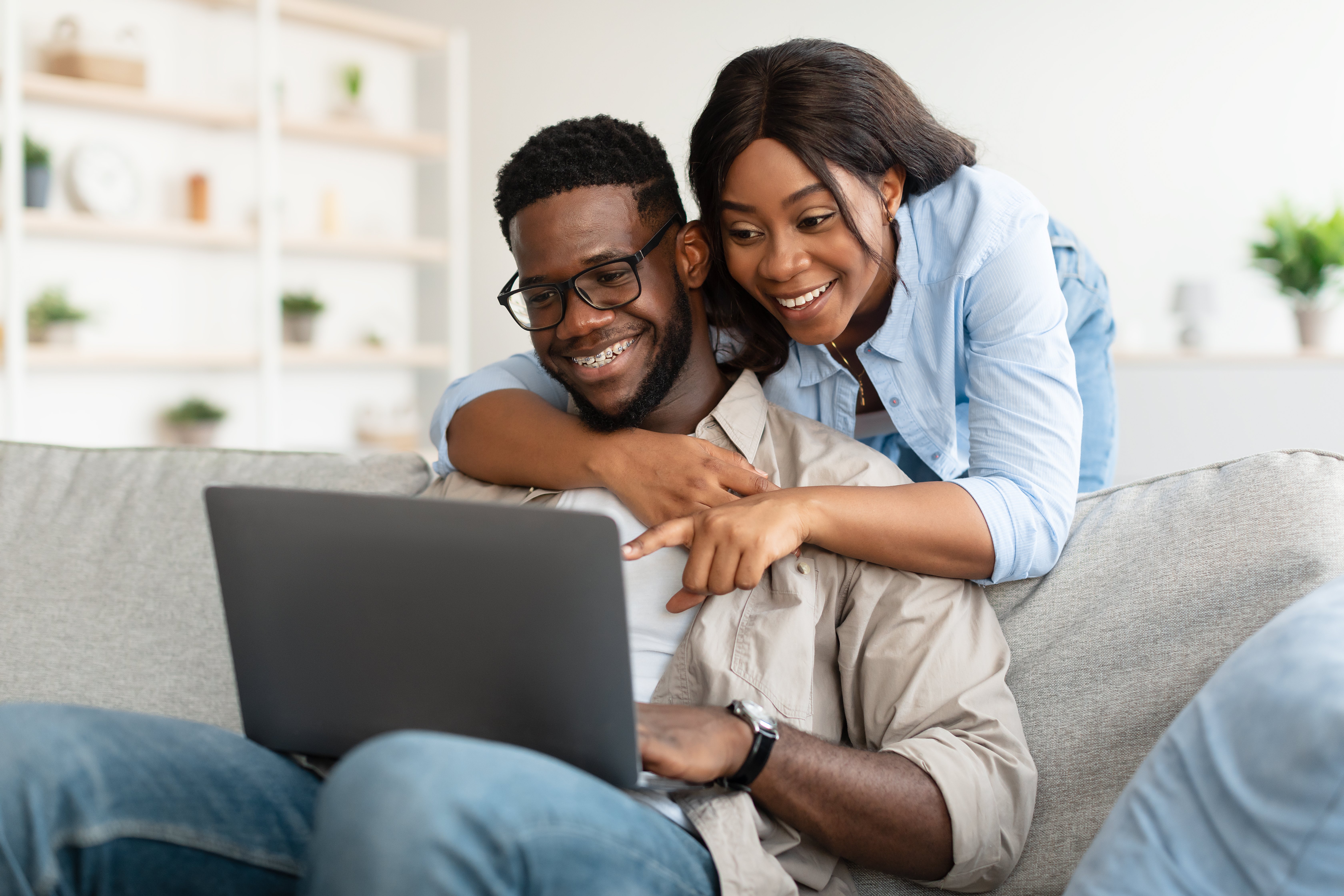 portrait-of-african-american-couple-using-computer-2021-12-09-07-52-21-utc